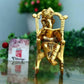 Golden Lord Ganesha Statue Sitting On A Rocking Chair And Reading Ramayan Showpiece
